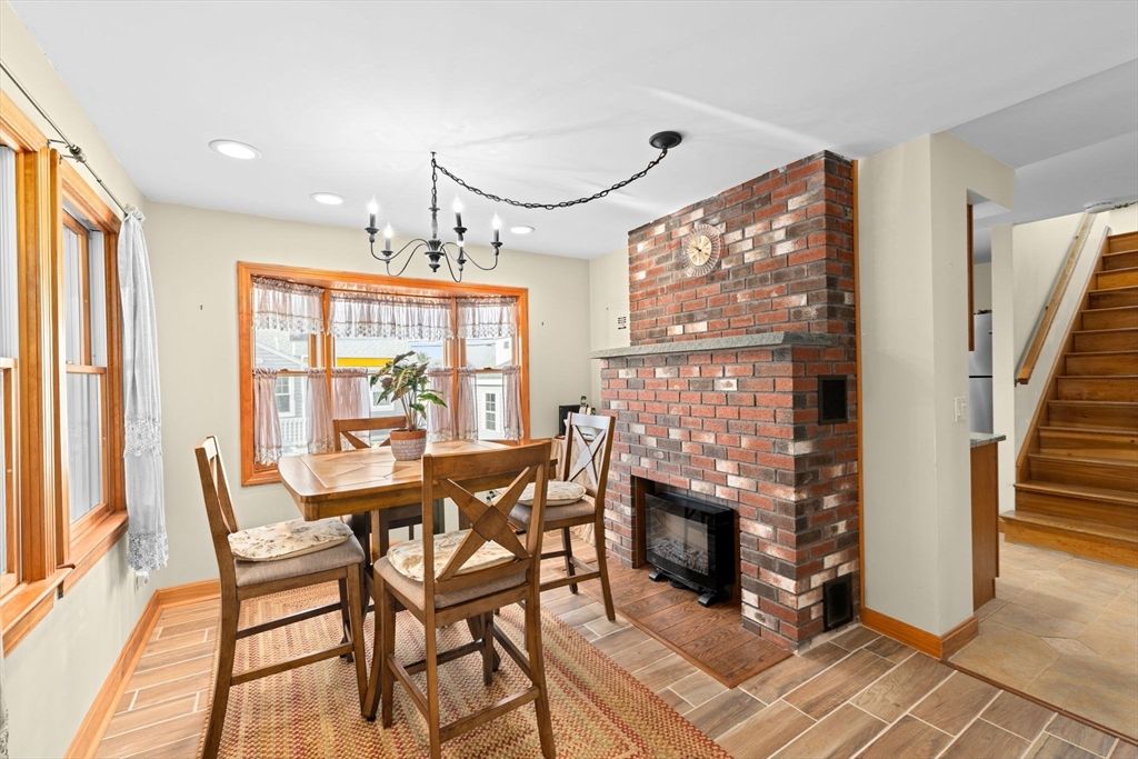 Chandelier, Dining room, Fireplace, Interior, Recessed Lighting, Stone Walls, Wood Texture Flooring