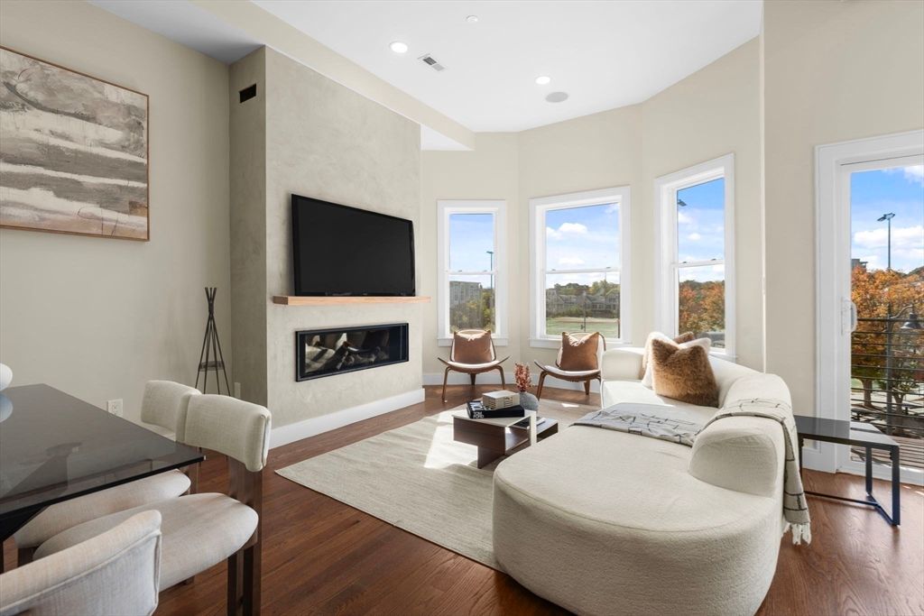 Dining room, Fireplace, Interior, Living room, Recessed Lighting, Wood Texture Flooring