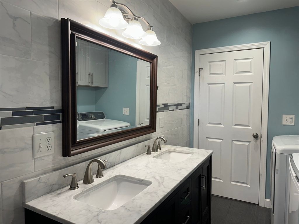 Bathroom, Dual Sink Vanities, Interior, Marble Walls, Wood Texture Flooring