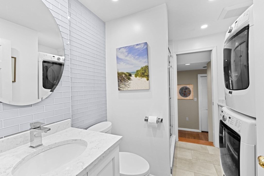 Bathroom, Interior, Recessed Lighting, Washer, Wood Texture Flooring