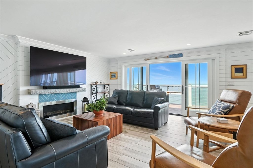 Fireplace, Interior, Living room, Recessed Lighting, Water, Wood Texture Flooring