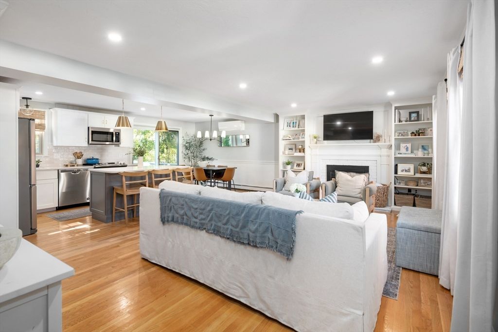 Dining room, Fireplace, Interior, Kitchen, Living room, Pendant Lights, Recessed Lighting, Stainless Steel Appliances, Wood Texture Flooring