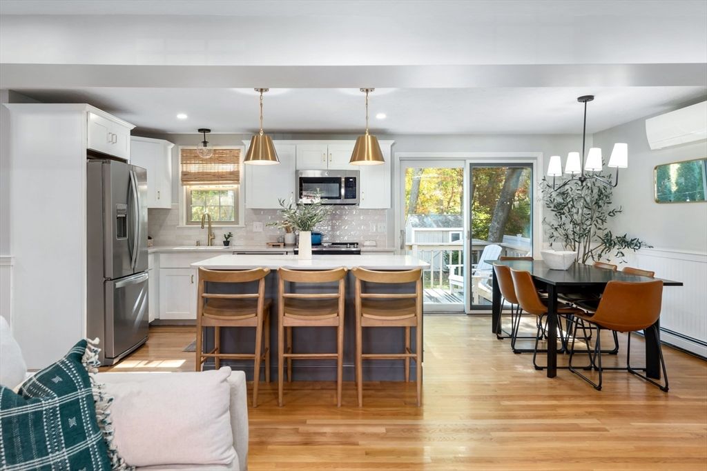 Dining room, Interior, Kitchen, Pendant Lights, Recessed Lighting, Stainless Steel Appliances, Wood Texture Flooring