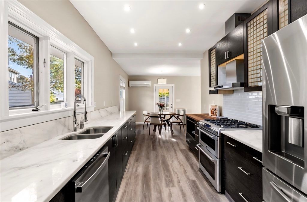 Dining room, Interior, Kitchen, Pendant Lights, Recessed Lighting, Stainless Steel Appliances, Wood Texture Flooring