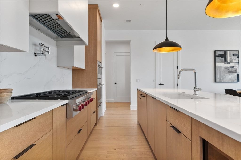 Interior, Kitchen, Marble Walls, Pendant Lights, Recessed Lighting, Wood Texture Flooring