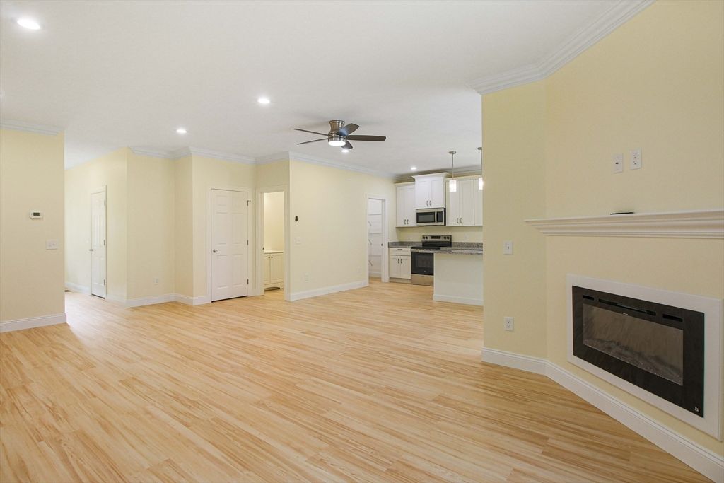 Empty room, Fireplace, Interior, Kitchen, Pendant Lights, Recessed Lighting, Wood Texture Flooring