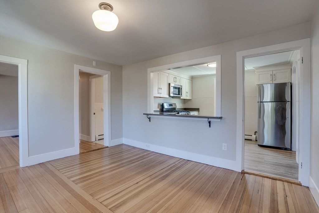 Empty room, Interior, Kitchen, Stainless Steel Appliances, Wood Texture Flooring