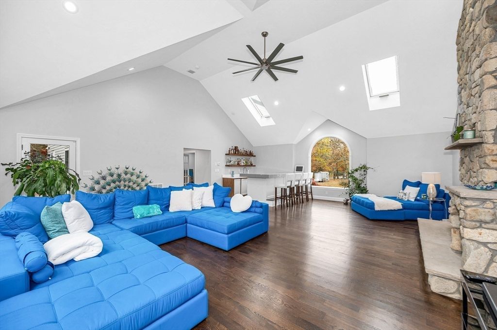 Dining room, Fireplace, Interior, Living room, Recessed Lighting, Stone Walls, Wood Texture Flooring