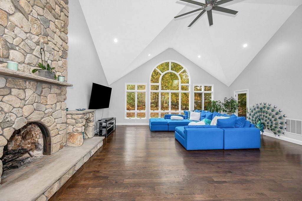 Fireplace, Interior, Living room, Recessed Lighting, Stone Walls, Wood Texture Flooring