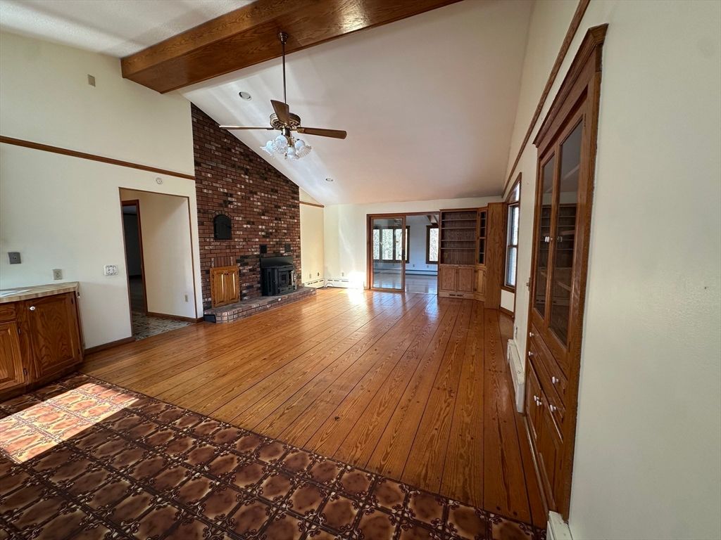 Empty room, Fireplace, Interior, Stone Walls, Wooden Beams, Wood Texture Flooring