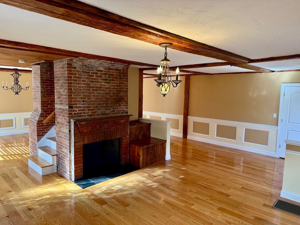 Empty room, Fireplace, Interior, Pendant Lights, Stone Walls, Wooden Beams, Wood Texture Flooring