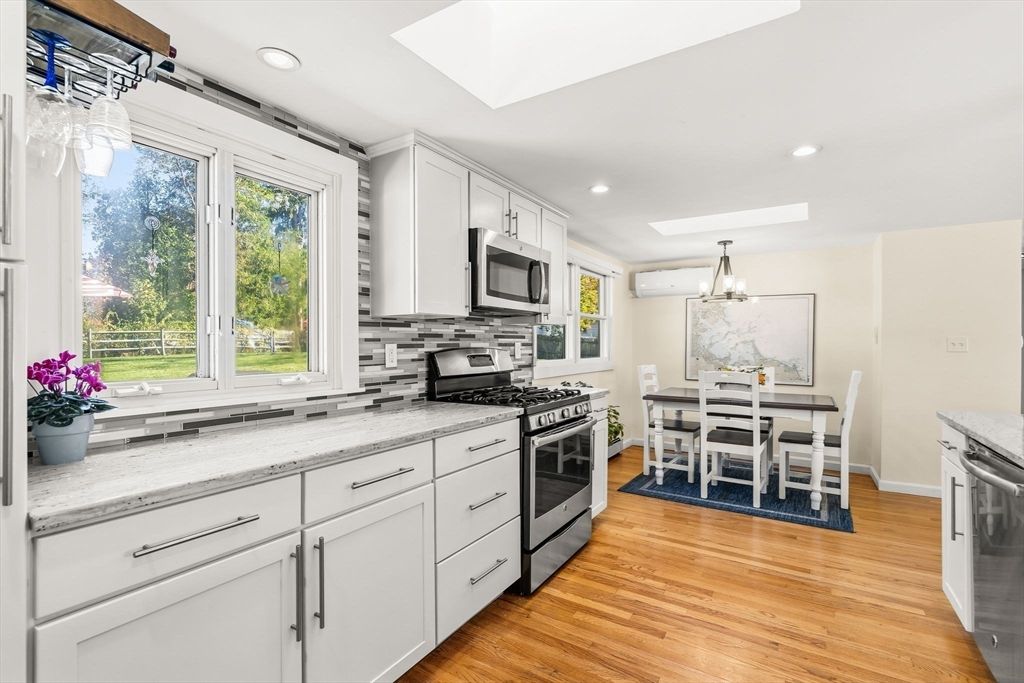 Chandelier, Dining room, Interior, Kitchen, Recessed Lighting, Stainless Steel Appliances, Wood Texture Flooring