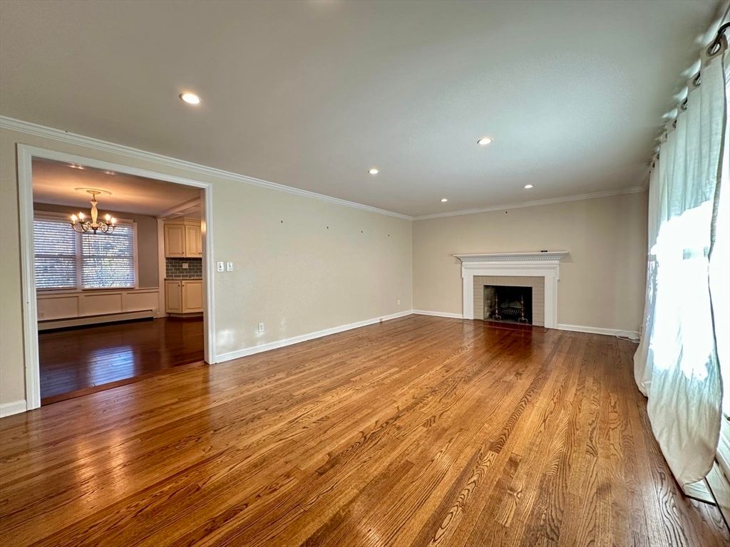 Chandelier, Empty room, Fireplace, Interior, Recessed Lighting, Wood Texture Flooring