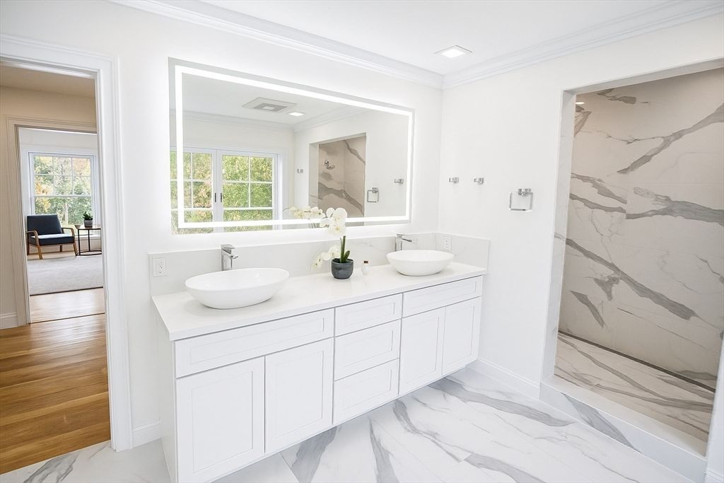Bathroom, Dual Sink Vanities, Interior, Marble, Marble Walls, Recessed Lighting, Wood Texture Flooring