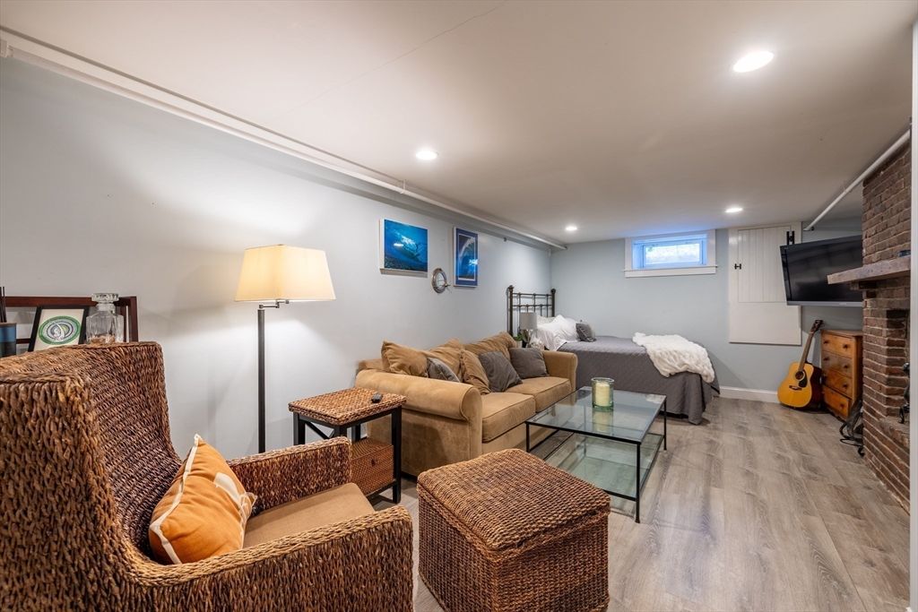 Fireplace, Interior, Living room, Recessed Lighting, Stone Walls, Wood Texture Flooring