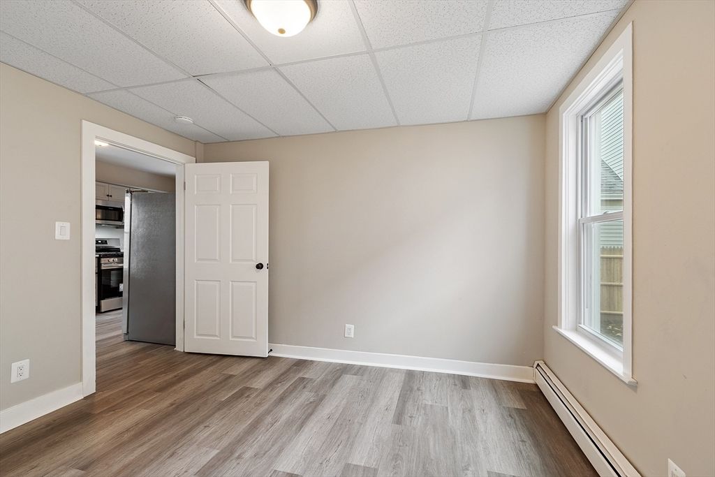 Empty room, Interior, Kitchen, Stainless Steel Appliances, Wood Texture Flooring