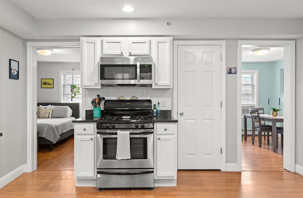 Bedroom, Dining room, Interior, Kitchen, Recessed Lighting, Stainless Steel Appliances, Wood Texture Flooring