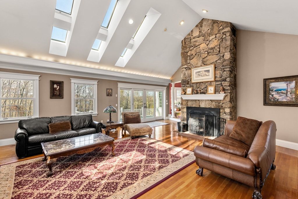 Fireplace, Interior, Living room, Recessed Lighting, Stone Walls, Wood Texture Flooring