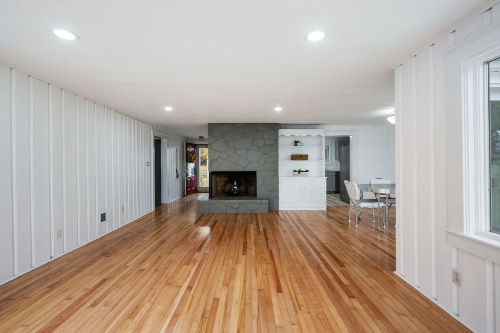 Dining room, Empty room, Fireplace, Interior, Recessed Lighting, Stone Walls, Wood Texture Flooring