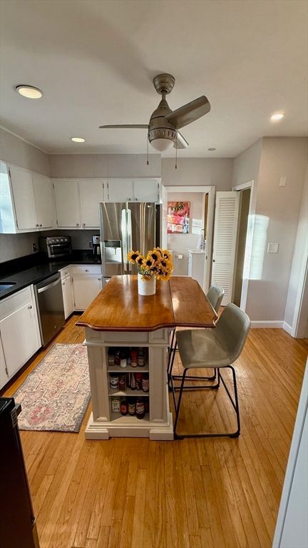 Dining room, Interior, Kitchen, Recessed Lighting, Stainless Steel Appliances, Wood Texture Flooring