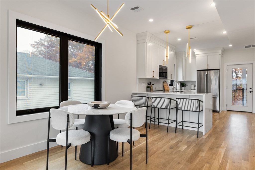 Dining room, Interior, Kitchen, Pendant Lights, Recessed Lighting, Stainless Steel Appliances, Wood Texture Flooring