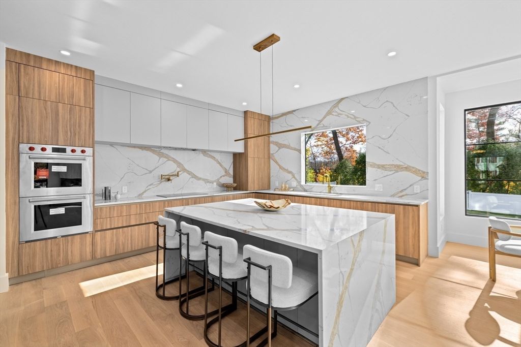 Interior, Kitchen, Marble Walls, Pendant Lights, Recessed Lighting, Stainless Steel Appliances, Wood Texture Flooring