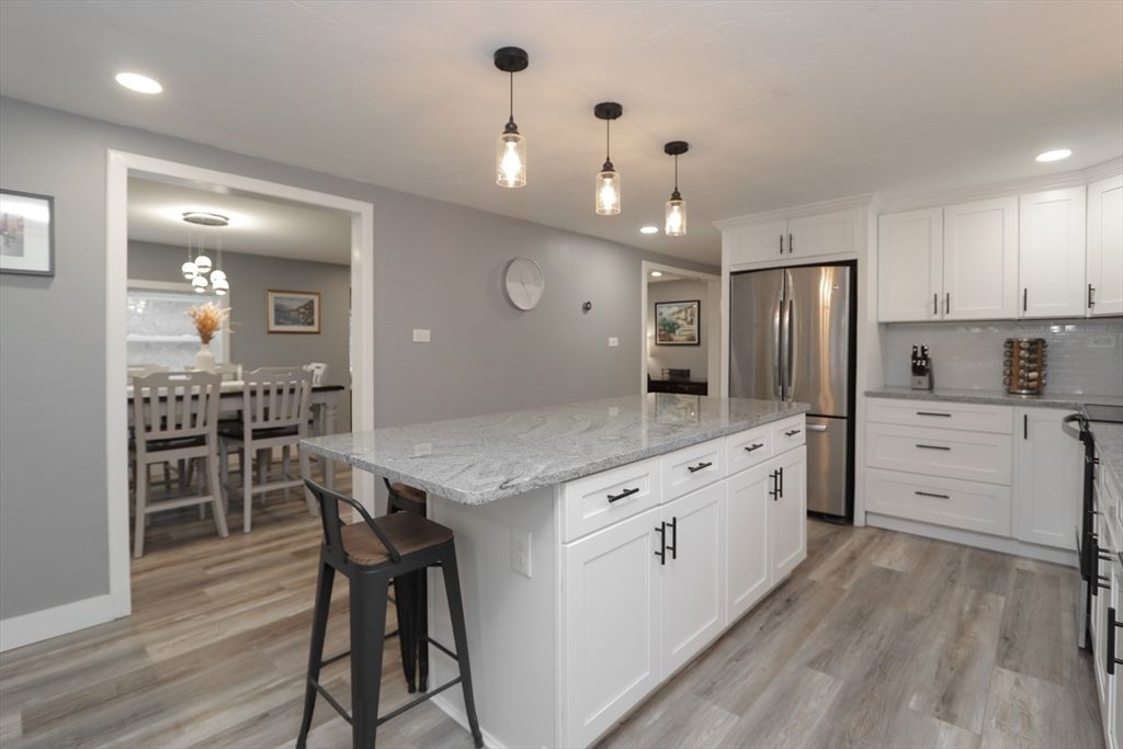 Dining room, Interior, Kitchen, Pendant Lights, Recessed Lighting, Stainless Steel Appliances, Wood Texture Flooring