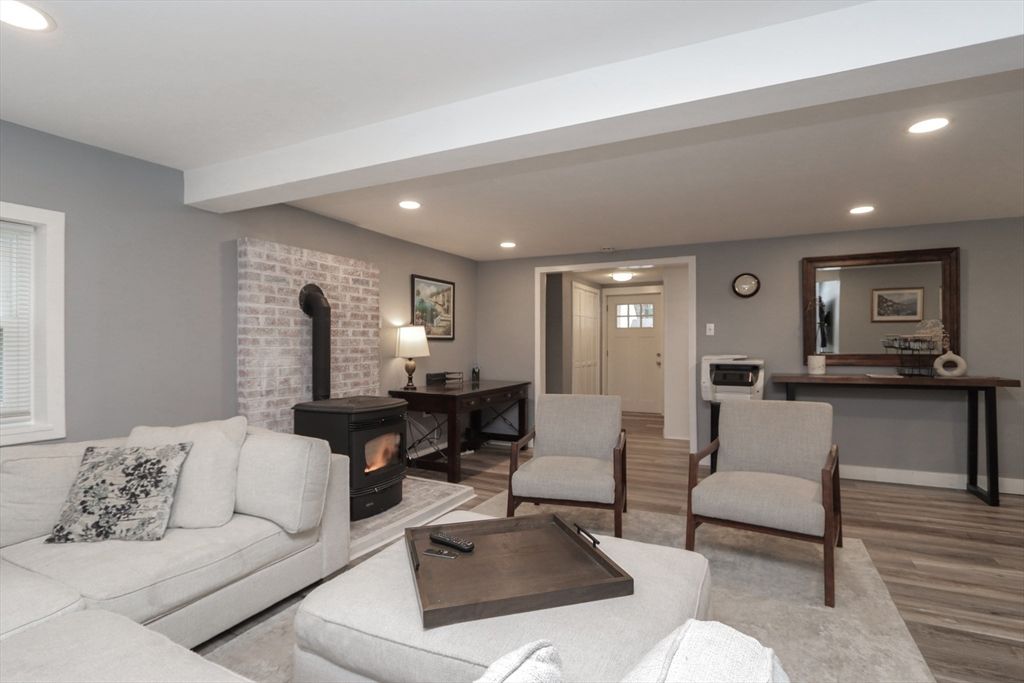 Fireplace, Interior, Living room, Recessed Lighting, Stone Walls, Wood Texture Flooring