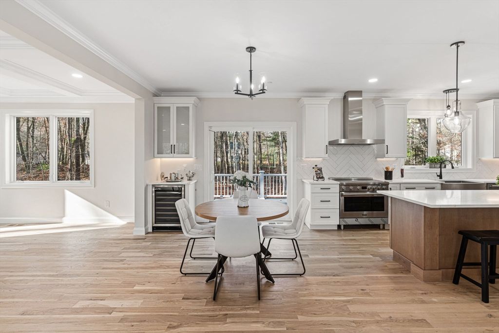 Chandelier, Dining room, Interior, Kitchen, Pendant Lights, Recessed Lighting, Stainless Steel Appliances, Wood Texture Flooring