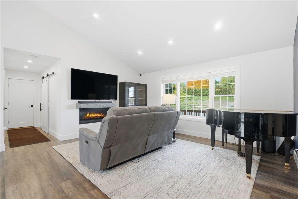 Fireplace, Interior, Living room, Piano, Recessed Lighting, Wood Texture Flooring