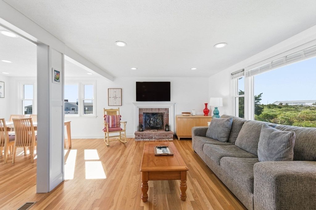 Dining room, Fireplace, Interior, Living room, Recessed Lighting, Wood Texture Flooring