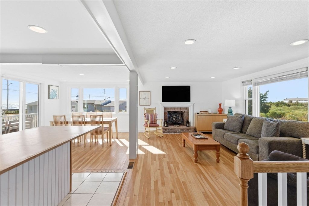 Dining room, Fireplace, Interior, Living room, Recessed Lighting, Wood Texture Flooring
