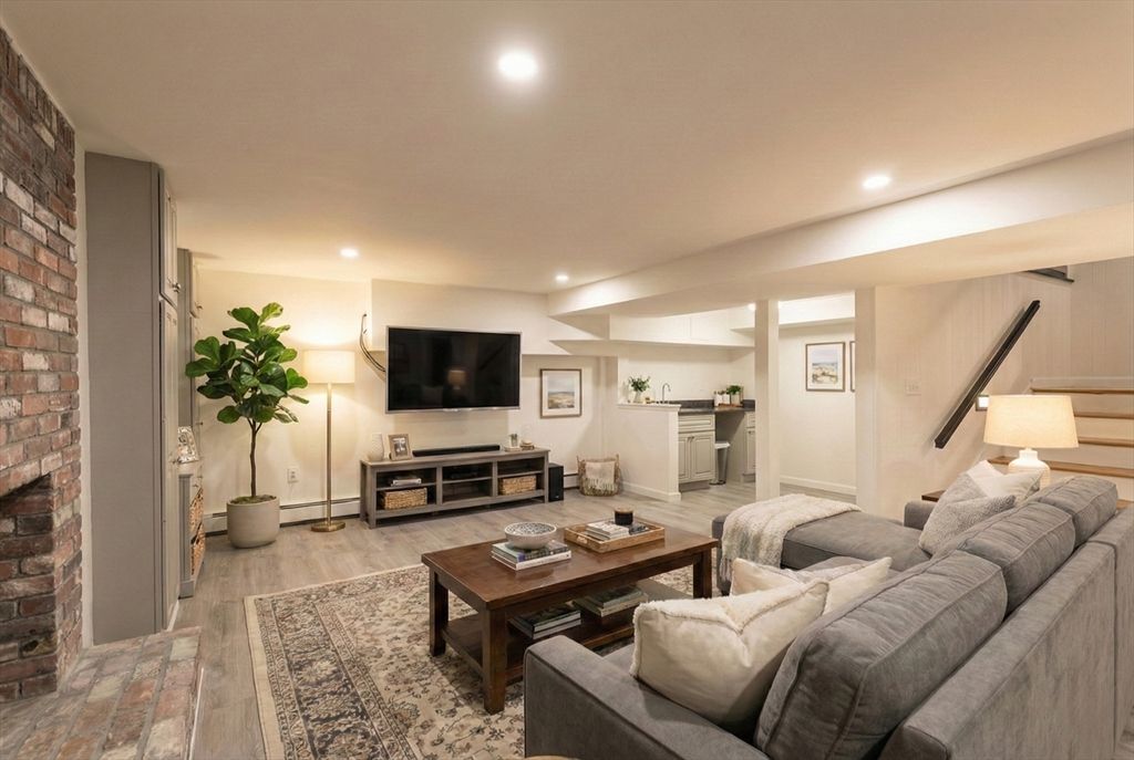 Fireplace, Interior, Living room, Recessed Lighting, Stone Walls, Wood Texture Flooring