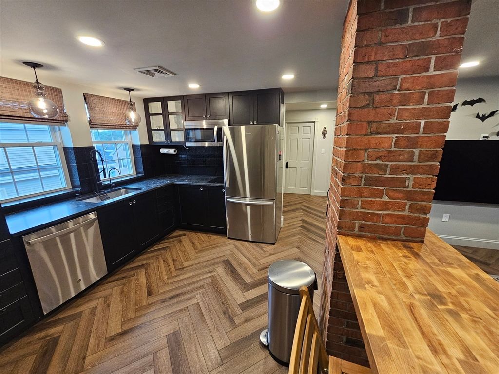 Interior, Kitchen, Pendant Lights, Recessed Lighting, Stainless Steel Appliances, Stone Walls, Wood Texture Flooring