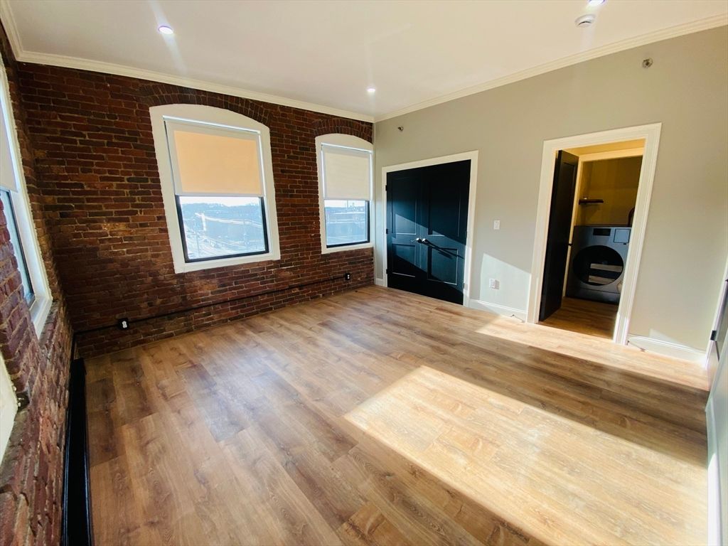 Empty room, Interior, Recessed Lighting, Stone Walls, Washer, Wood Texture Flooring