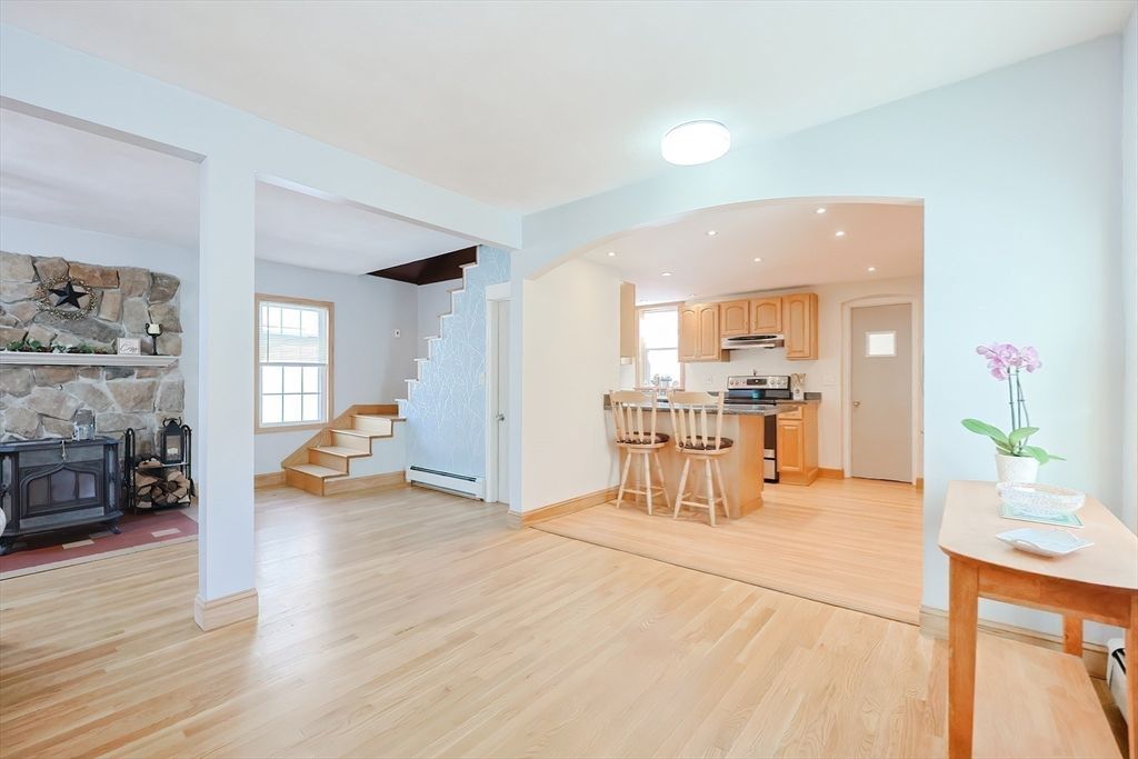 Dining room, Fireplace, Interior, Kitchen, Recessed Lighting, Stone Walls, Wood Texture Flooring