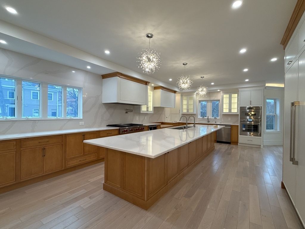 Chandelier, Interior, Kitchen, Marble Walls, Recessed Lighting, Stainless Steel Appliances, Wood Texture Flooring