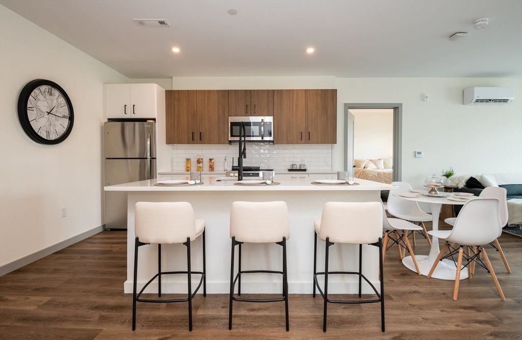 Dining room, Interior, Kitchen, Recessed Lighting, Stainless Steel Appliances, Wood Texture Flooring