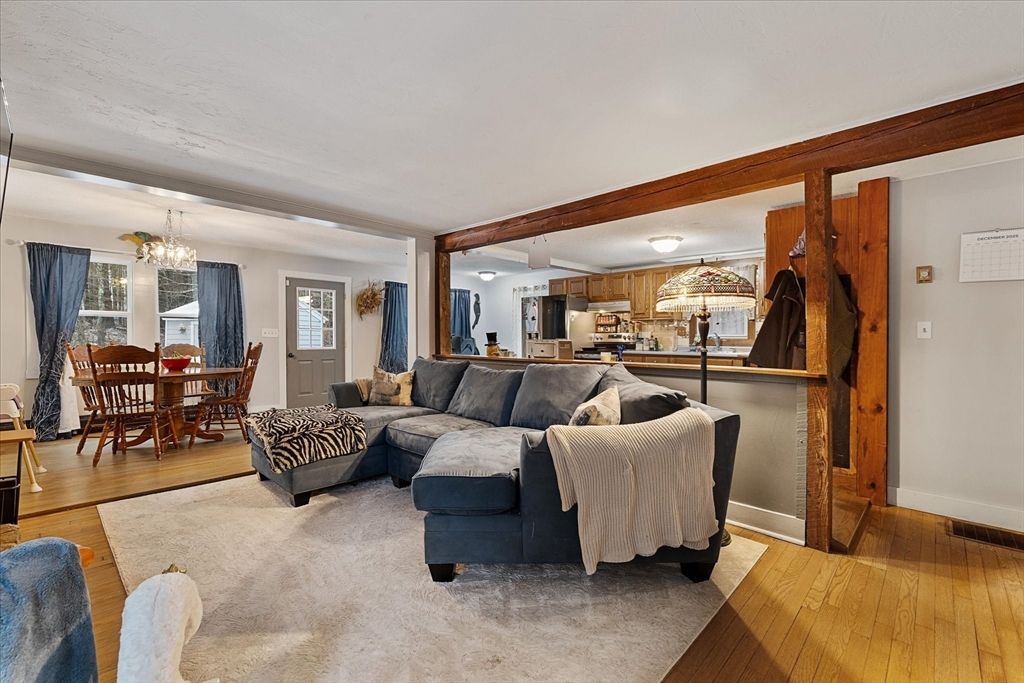 Chandelier, Dining room, Interior, Kitchen, Living room, Stainless Steel Appliances, Wood Texture Flooring