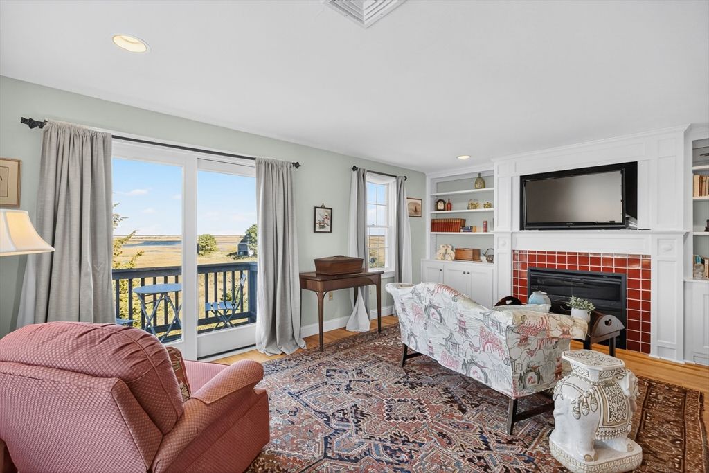 Fireplace, Interior, Living room, Recessed Lighting, Water, Wood Texture Flooring