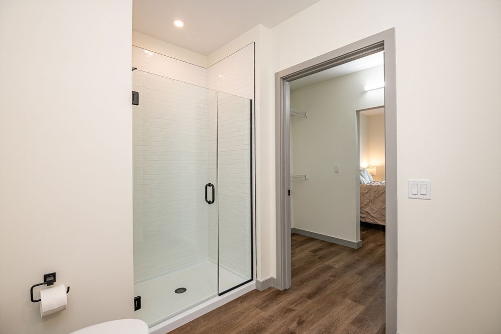 Bathroom, Bedroom, Glass Shower, Interior, Recessed Lighting, Wood Texture Flooring