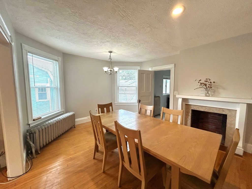 Chandelier, Dining room, Fireplace, Interior, Recessed Lighting, Wood Texture Flooring