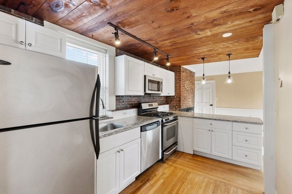 Interior, Kitchen, Pendant Lights, Recessed Lighting, Stainless Steel Appliances, Stone Walls, Wooden Ceilings, Wood Texture Flooring