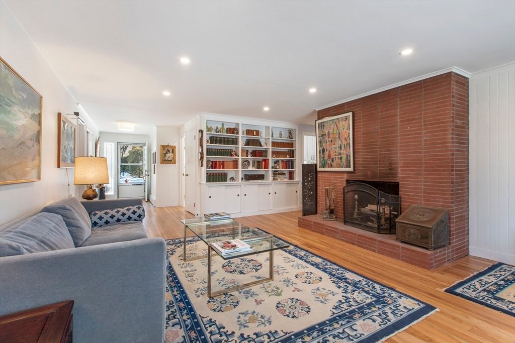 Fireplace, Interior, Living room, Recessed Lighting, Stone Walls, Wood Texture Flooring