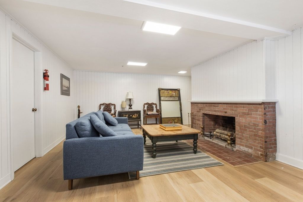 Fireplace, Interior, Living room, Recessed Lighting, Stone Walls, Wood Texture Flooring