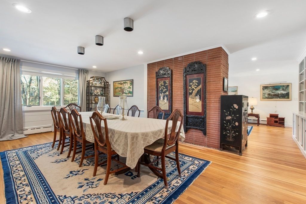 Dining room, Fireplace, Interior, Recessed Lighting, Stone Walls, Wood Texture Flooring