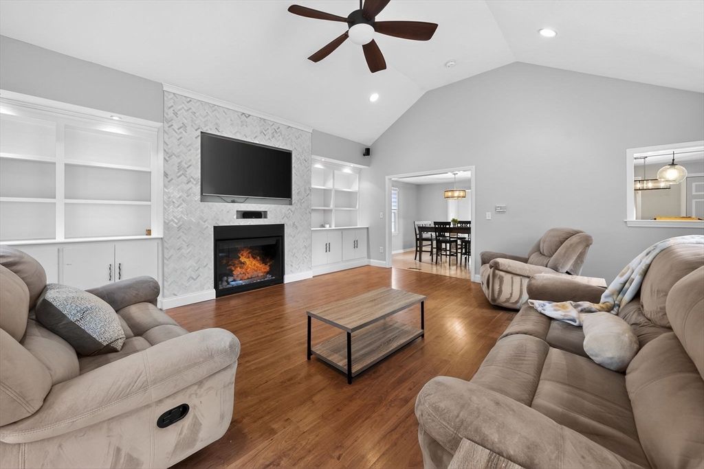Dining room, Fireplace, Interior, Living room, Pendant Lights, Recessed Lighting, Wood Texture Flooring
