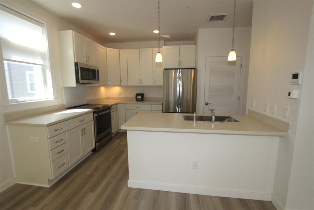Interior, Kitchen, Pendant Lights, Recessed Lighting, Stainless Steel Appliances, Wood Texture Flooring