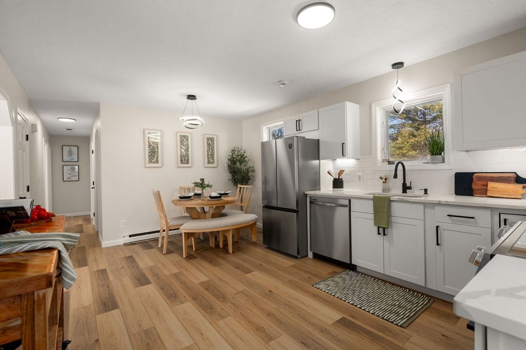 Dining room, Interior, Kitchen, Pendant Lights, Stainless Steel Appliances, Wood Texture Flooring