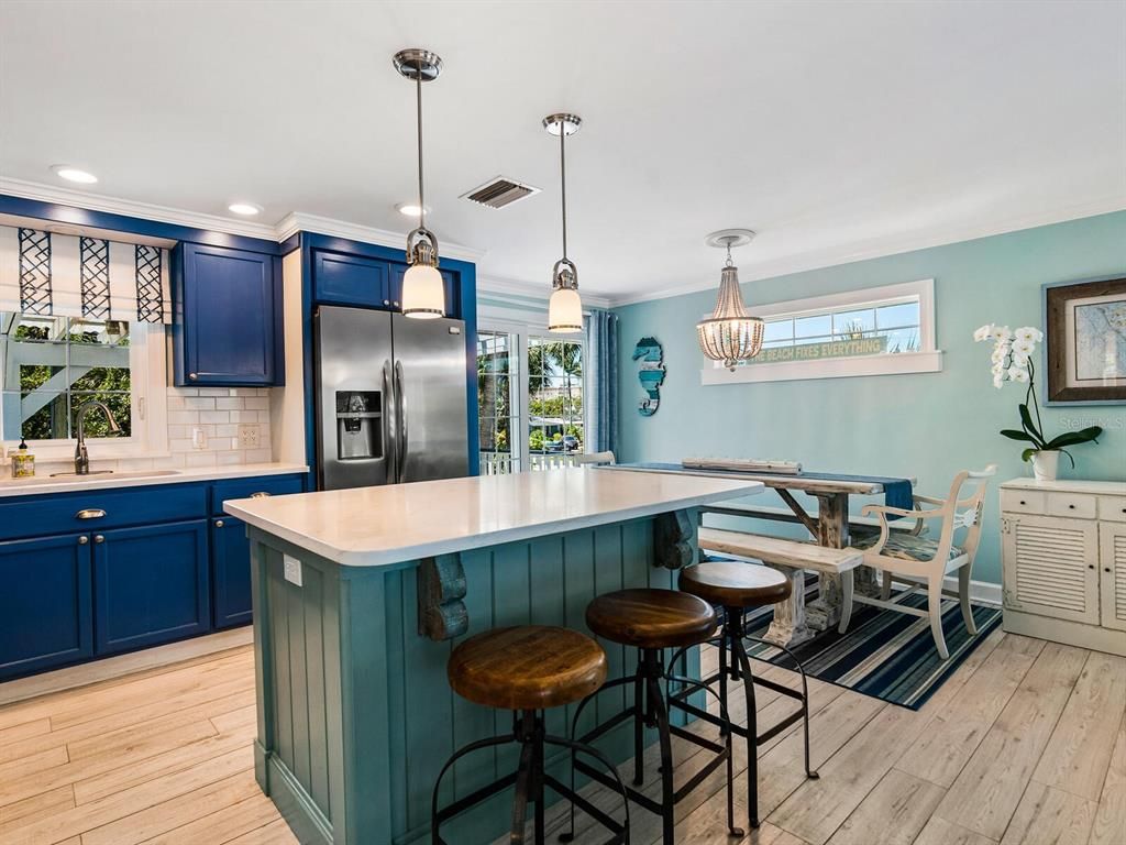 Chandelier, Dining room, Interior, Kitchen, Pendant Lights, Recessed Lighting, Stainless Steel Appliances, Wood Texture Flooring